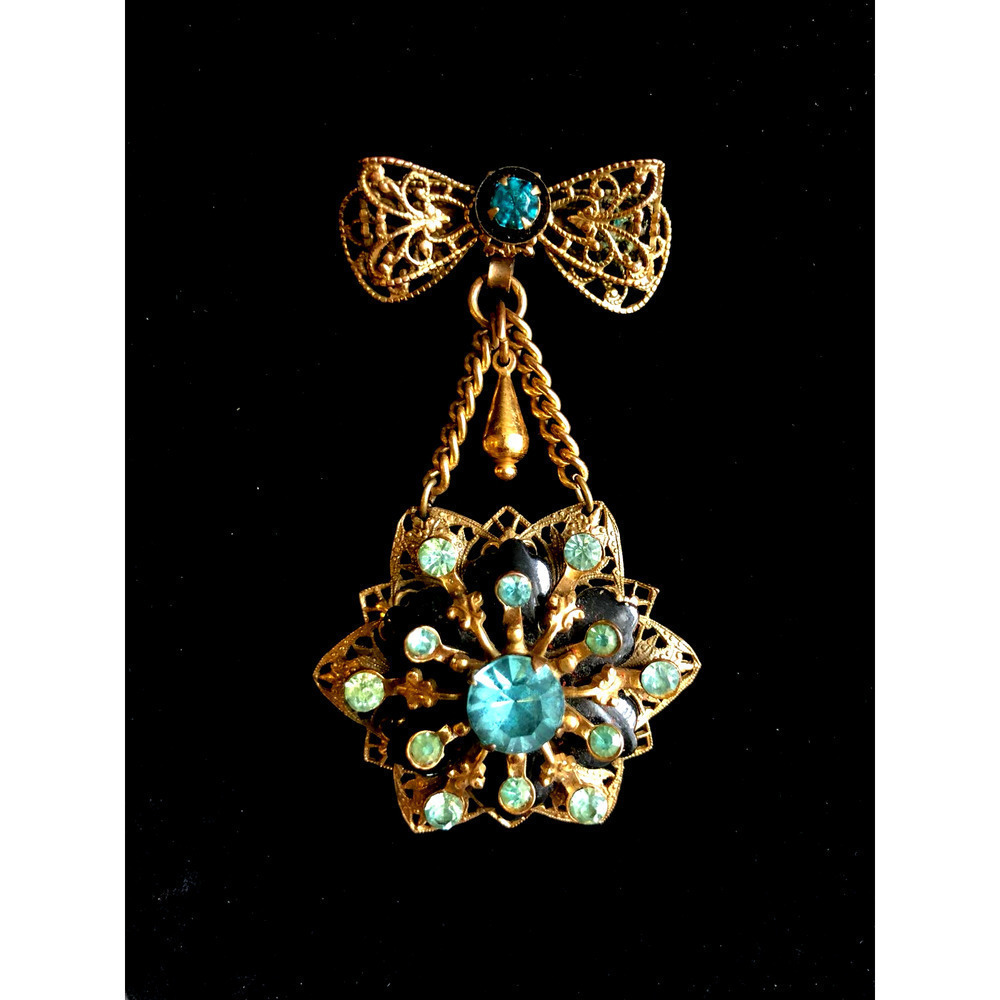 Stunning filigree brooch with turquoise rhinestones